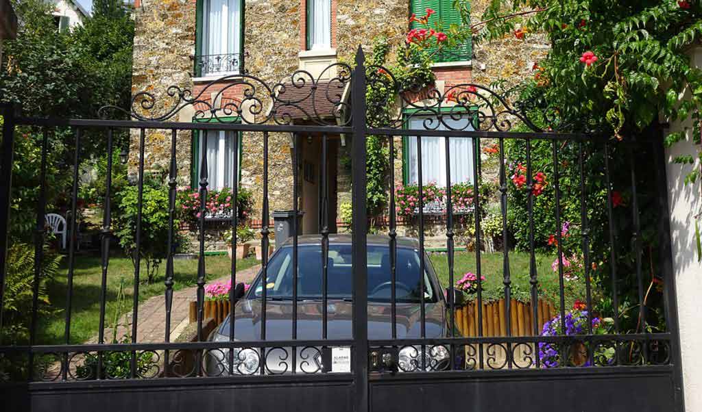 garden and fencing surrounds and a car